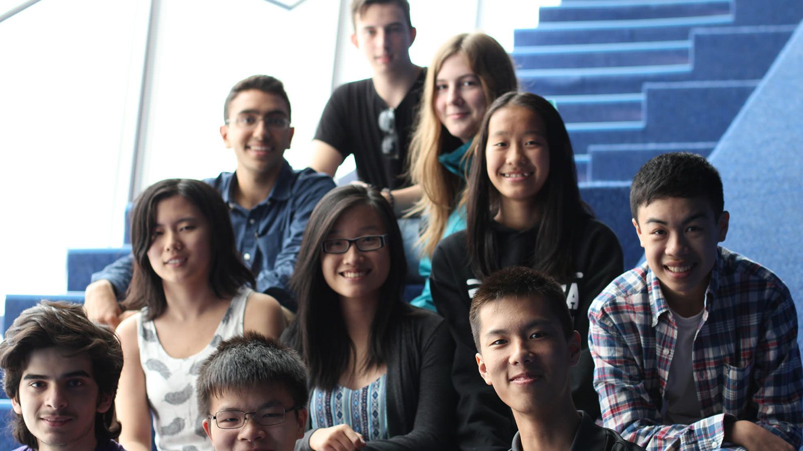 Photo of group of students smiling at camera.